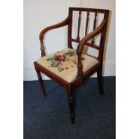 A Regency mahogany elbow chair with floral woolwork seat