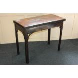 A George III mahogany card table with new baize insert and carved edges, on square chamfered legs,