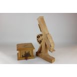 An inlaid wooden box with drawer, the top with a silhouette of a telescope, 16cm, and a wooden model