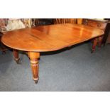 A Victorian mahogany D end extending dining table on carved turned legs, with two leaves, 250cm