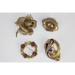 A Victorian gold enamel and pearl brooch, a gold brooch with glazed hair compartment, a gold