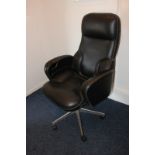 A black leather office chair on swivel base, (SPM)