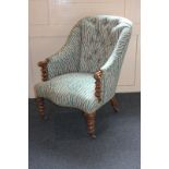 A 19th century walnut framed tub chair with button back, turned supports and legs