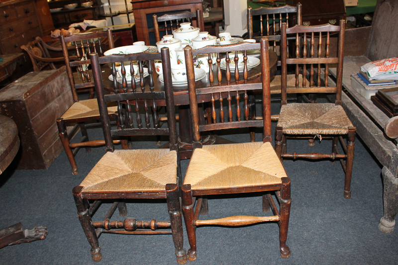 A matched set of six oak framed rush seat chairs
