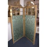 A two-panel room screen with carved gilt wood and gesso surmount of a  phoenix and an urn with