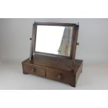 A mahogany box base toilet mirror with beaded edging, on two short drawers, 43cm