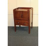 A George III mahogany cabinet commode enclosed by two doors, 54cm