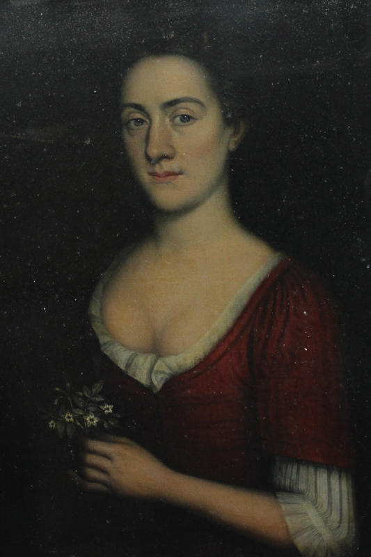 Circle of Nicolas de Largilliere portrait of a lady, half length, wearing a red bodice and holding a
