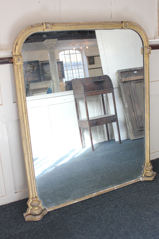 A large gilt wood and gesso overmantle mirror, 109cm by 132cm, (NC)