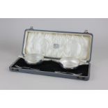 An Art Deco cased set of two silver pickle dishes and forks, maker Charles Perry & Co, Chester 1929,