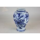 A Delftware pottery vase, ovoid form with floral decoration (a/f - restored), 19cm high