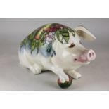 A Moorcroft pottery model of Peter the Pig, circa 1990, modelled by Roger Mitchell and decorated