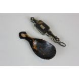 A tortoiseshell caddy spoon with unmarked yellow gold monogrammed inlay, together with a pair of