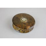 A burr walnut and tortoiseshell circular box with a gilt mounted floral central insert