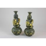 A pair of Chinese bronze wedding candlesticks, seal mark to base, 23cm high