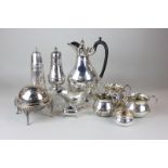 Two silver plated sugar shakers, a jam pot with glass liner and revolving lid, a silver plated hot