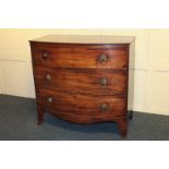 A late Regency mahogany bowfront chest of three long graduated drawers on splayed feet, 93cm