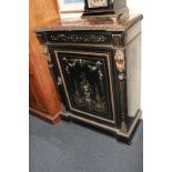 A 19th century ebonised cabinet with marble top, finely inlaid with floral swags around an urn of