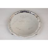 An Elizabeth II silver salver with gadroon border, on four claw and ball feet (inscribed), 10.4oz