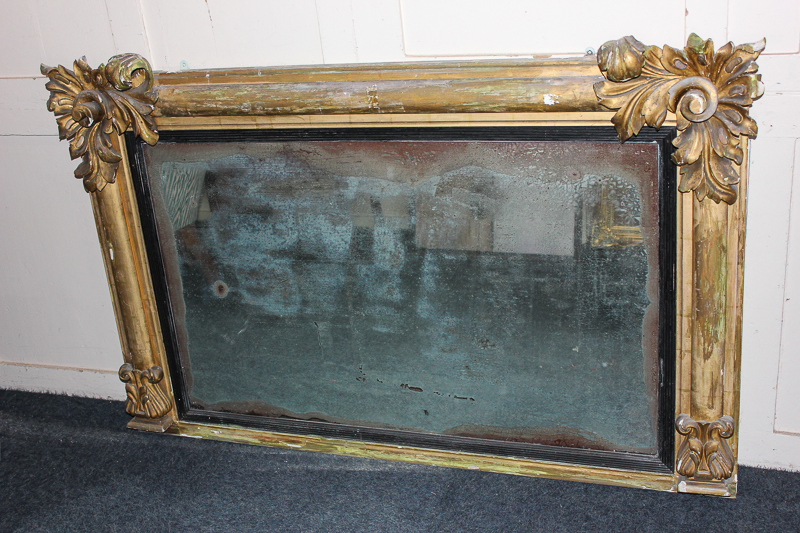A Regency gilt framed overmantle mirror with carved leaf corners 138cm by 84cm (NC)