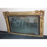 A Regency gilt framed overmantle mirror with carved leaf corners 138cm by 84cm (NC)