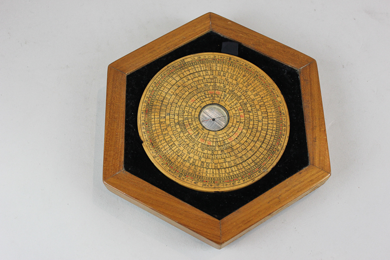 A Chinese circular wooden compass 14cm, in fitted hexagonal case, 23cm, (SPM)