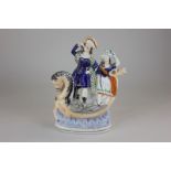 A 19th century Staffordshire pottery figure of highlanders on a boat with a horse figurehead and