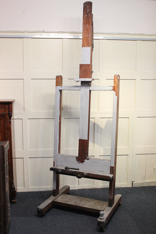 A large mahogany artist's easel, 81cm by 256cm (NC)