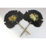 A pair of Victorian black lacquer face screens with painted floral decoration (a/f - repaired)