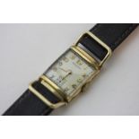 Hamilton, a rolled gold wrist watch rectangular case with hinged lugs signed dial and movement and