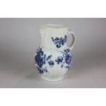 A Caughley mask head jug with transfer printed floral decoration, 18cm high