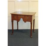 A small 18th century oak lowboy with three drawers on slender legs, 75cm