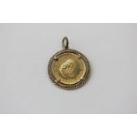 A South African 1969 1 Rand gold coin set in pendant mount
