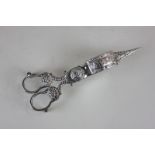 A silver plated candle snuffer with embossed detail