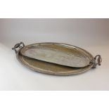 A silver plated oval tea tray and a silver plated decanter tray