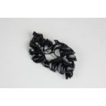 A large Whitby jet brooch carved and pierced as entwined leaves