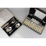 A cased set of silver plated serving spoons, fork and knife, together with a cased silver plated