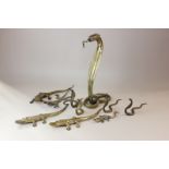 A collection of ten brass models of snakes, lizards and a crocodile, (SPM)