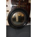 A large ebonised framed 19th century circular convex mirror 118cm diameter (NC)