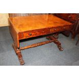 A George III walnut sofa table with one short and one dummy drawer to each side, on tapered legs