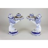 A pair of 17th/18th century Delftware candle holders modelled as lions by Aelbregt Keizer (AK mark