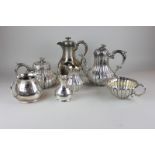 A four piece silver plated tea and coffee set together with another hot water pot and a matching