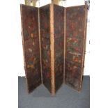 A painted leather four-panel room screen decorated with roses and scrollwork, each panel 46cm by