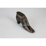 A Victorian mahogany snuff box modelled as a lady's shoe, with brass inlay and ebonised finish