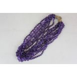 An amethyst bead six row necklace with silver gilt bolt ring clasp
