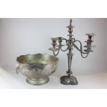 A silver plated punch bowl with embossed floral swag decoration on stand with lion ring handles,