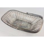 A silver plated cake basket (monogrammed)