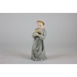 A Royal Worcester candle snuffer modelled as a monk in a grey habit, 12cm high