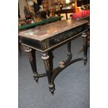 A 19th century ebonised side table with marble top, finely inlaid with floral scrollwork in brass,