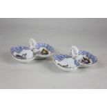 A pair of German porcelain sweetmeat dishes depicting scenes of lovers, with gilt embellishment,